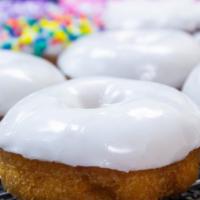 Vanilla Frosted Cake · A classic cake donut with vanilla frosting and your choice of topping