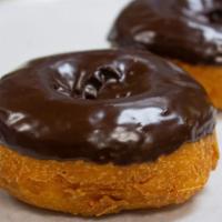 Chocolate Frosted Cake · A classic cake donut with chocolate frosting and your choice of topping