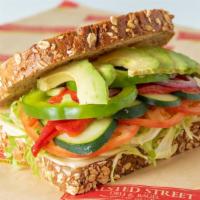 Washington St. (Veggie) · Several layers of swiss cheese topped with shredded lettuce, avocado, cucumber, roasted red ...