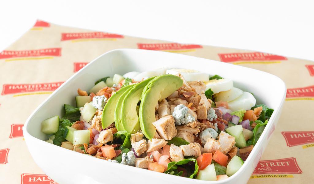 Cobb Salad · Fresh cut romaine, bacon, hard-boiled eggs, avocado, cucumber, red onion, tomato, blue cheese crumbles, and dressing.