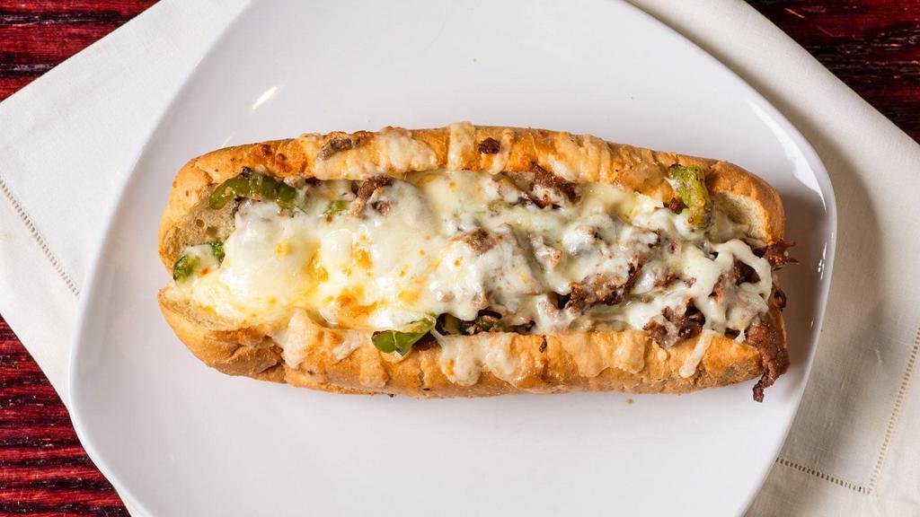 Philly Steak & Cheese · Grilled green peppers and onions smothered with Provolone cheese. Served with fries.