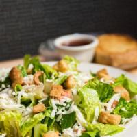 Dinner Salad · Crisp lettuce, onions, croutons and you choice of dressing.