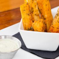 Yuca Fries · Served with roasted garlic aioli sauce.