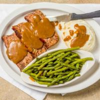 Meatloaf · Chef's combination of seasoned beef, veal and pork served topped with our pan beef gravy.