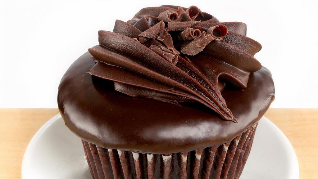 Chocolate Decadence · chocolate cake, chocolate mousse filling, chocolate ganache and dark chocolate curls.