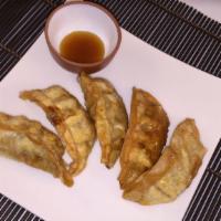 Gyoza (5 Pcs.) · Five dumplings filled with ground chicken and cabbage.