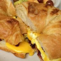 Breakfast Sandwich · Three eggs any style with your choice of cheese and choice of bacon, sausage, ham steak, tur...