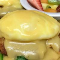 Crab Cake Gouda Benedict · Crab cakes layered with baby spinach, bacon and smoked Gouda cheese topped with two eggs any...
