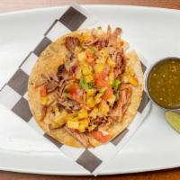 Al Pastor · Marinated pork topped with grilled pineapple, salsa, onion and cilantro.