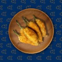 Jalapeno Poppers · Jalapenos stuffed with fresh herbs, cheese and diep fried till golden and crisp.