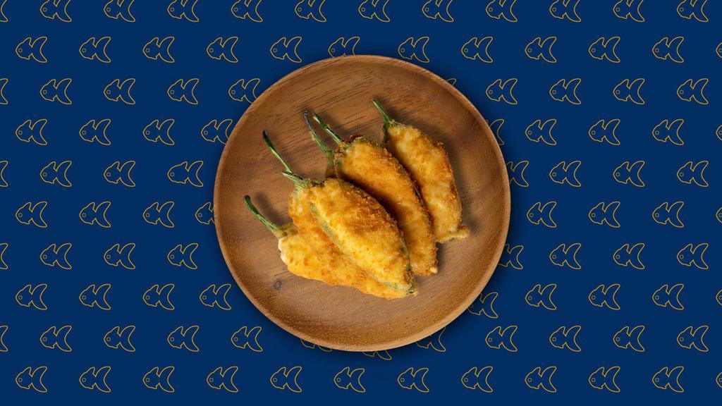 Jalapeno Poppers · Jalapenos stuffed with fresh herbs, cheese and diep fried till golden and crisp.