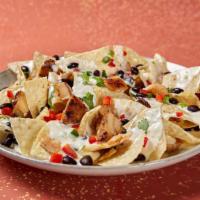 Alright, Alright, Alright Nachos · Served with chips, beans, Moe's Famous Queso, pico de gallo and choice of protein.