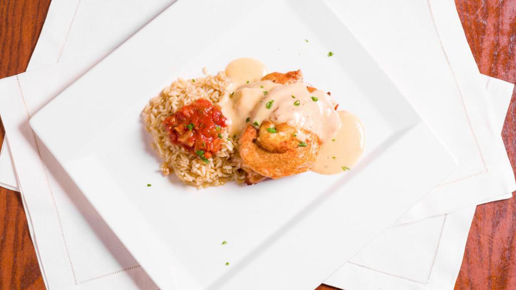 Maryland Chicken · Served with crabmeat stuffing, lobster cream and rice pilaf.