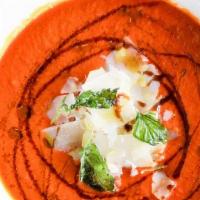 Tomato Basil Soup · Smooth soup with pureed tomatoes and basil.