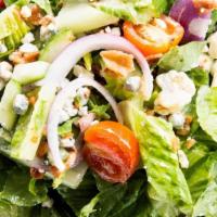 Chop Salad · Hearts of Romaine lettuce, tomato, cucumber, red onion, blue cheese, and bacon. Recommended ...
