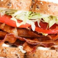 Piled High B.L.T Sandwich · Bacon, shredded lettuce, tomato, garlic aioli, thin cut multigrain wheat bread.