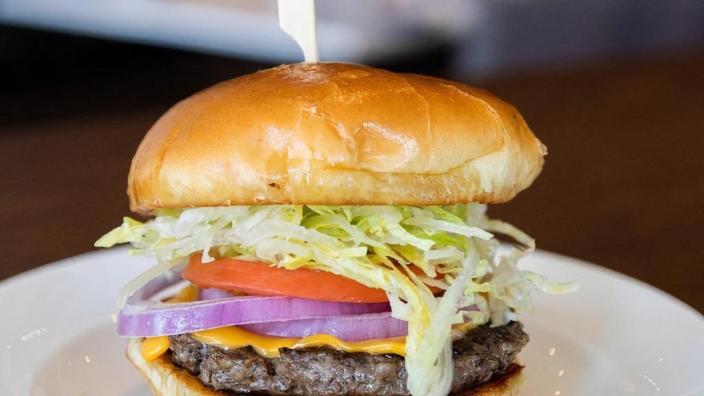 Classic Half Pound Burger · Half pound short rib & brisket patty, American cheese, shredded lettuce, tomato, onion, brioche bun.