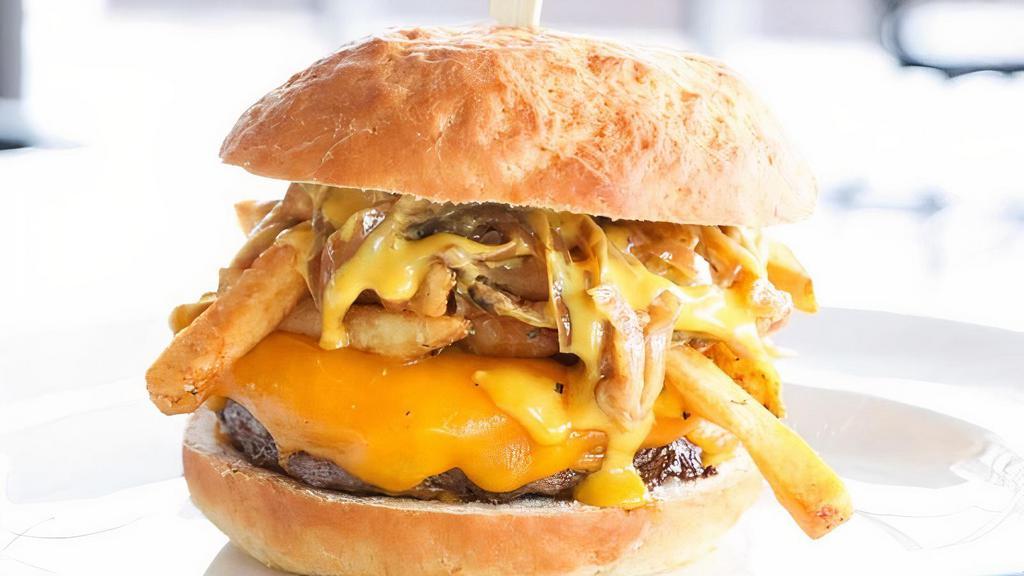Bbq Bourbon Burger · Half-pound burger patty, bourbon onions, pork belly, Cheddar, BBQ sauce, chipotle ranch dressed Romaine, brioche bun.