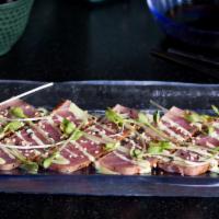 Tuna Carpaccio · Spicy.Fresh tuna seared cajun style served with a spicy horseradish sauce.
