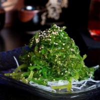Seaweed Salad · Vegetarian. Neon green, angel-hair threads of seaweed, tangled with sesame seed and a light ...