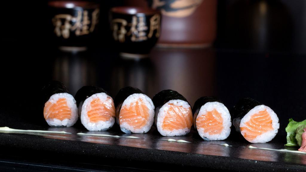 Salmon Roll · Fresh salmon rolled in rice and nori, paper out.
