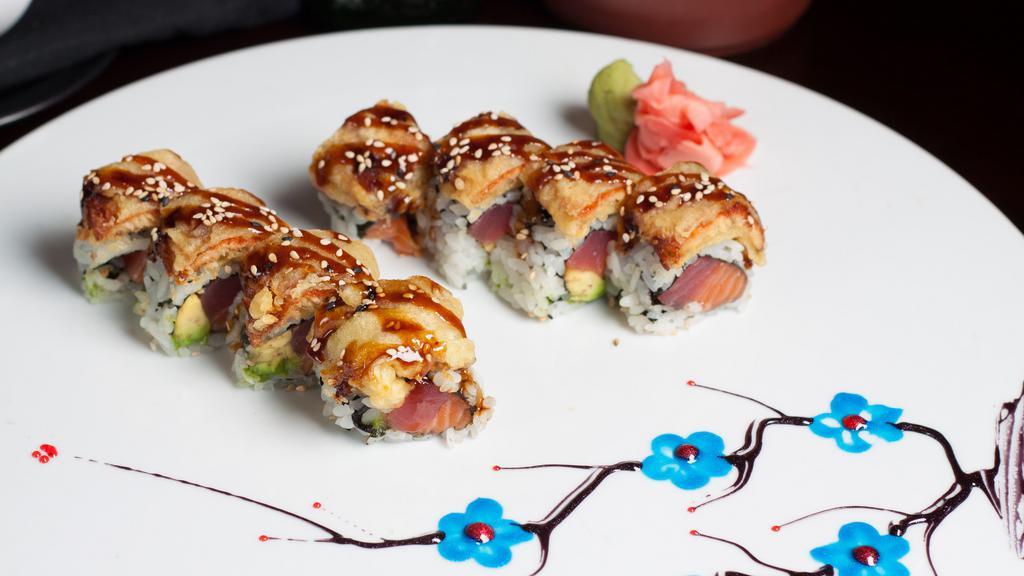 Monster · Tuna, salmon, and avocado topped with a generous portion of crispy smoked tempura eel, with eel sauce.