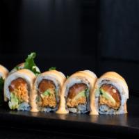 Tsunami · Salmon, spicy crabmeat, avocado topped with white tuna and spicy mayo sauce.