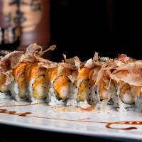Volcano · Shrimp tempura and spicy crabmeat topped with flame torched spicy salmon and tuna, and bonit...