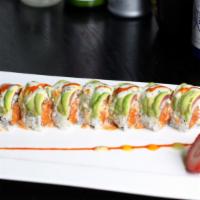 Tuna Hana · Crunchy spicy tuna roll topped with slices of tuna and another layer of avocado, with peach ...