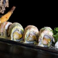 Dancing Shrimp · Shrimp tempura style mango and crabmeat topped with butterfly shrimp and avocado with peach ...