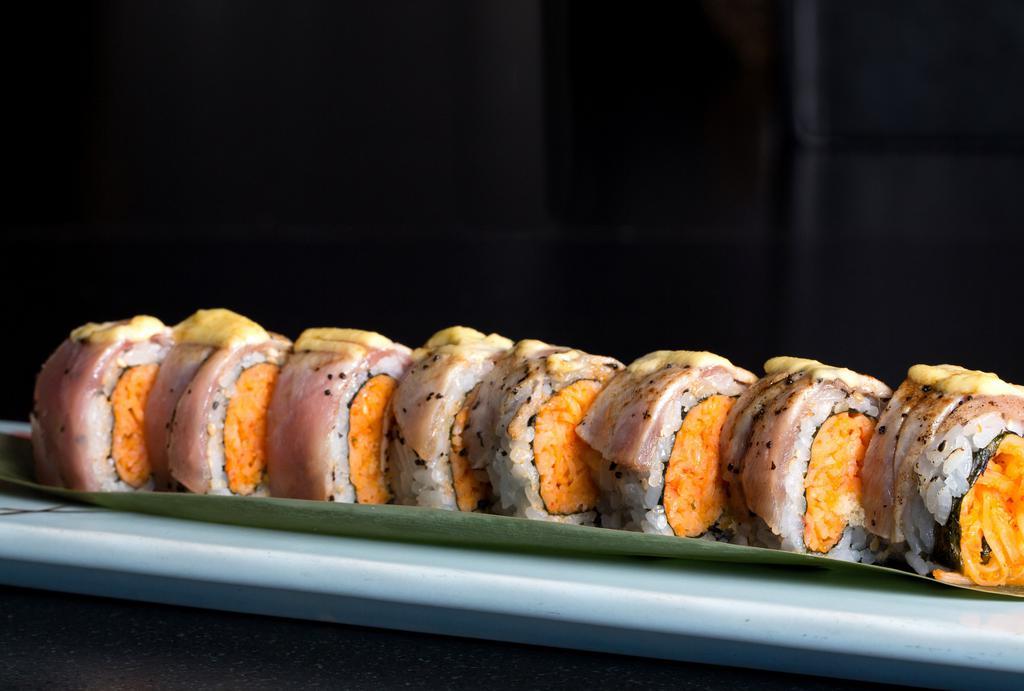 Kobe San · Spicy crabmeat and tempura crunchy topped with seared black pepper tuna flame torched with Japanese mayo.