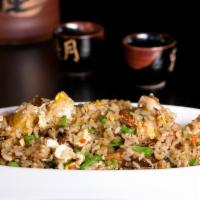 Hawaiian Fried Rice · Fresh shrimp with pineapple, raisin, onion, snow peas, sunflower seeds, carrot, egg and aged...