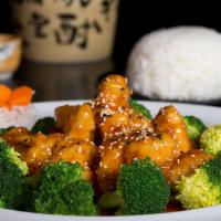 Sesame Chicken · Golden fried chicken honey glazed, with sesame sauce, and sprinkled sesame seed served with ...