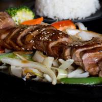 Steak Teriyaki · Grilled steak served on a bed of sizzling onions and bell pepper in teriyaki sauce and sprin...