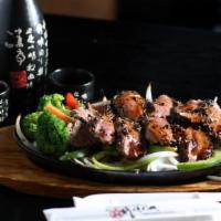 Peppercorn Steak Teriyaki · Grilled steak with peppercorns served on a bed of sizzling onions and bell pepper in teriyak...
