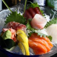 Sashimi Deluxe · Assorted fillets of fresh raw fish (14 pieces).