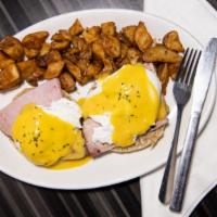 Eggs Benedict · Virginia baked ham, poached eggs, Hollandaise, English muffin, home fries