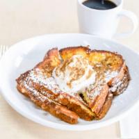 Challah French Toast · Thick cut Challah bread topped with powdered sugar and cinnamon