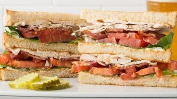 Turkey And Bacon Club Sandwich · Sliced turkey with crispy bacon, lettuce, sliced tomato, and mayo on your choice of bread.