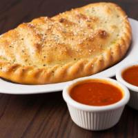 Calzone · Mozzarella cheese wrapped with butter-brushed dough, sprinkled with parmesan & oregano, then...