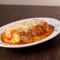 Baked Lasagna · A large portion of our homemade lasagna. Featuring four layers of ribbon noodles, eggs, spic...