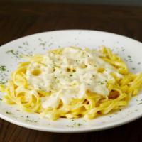 Family Tray Of Fettuccine Alfredo · Serves 5-6 people. Flat noodles and cream sauce. Served with four 3