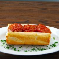 Meatball Parmigiana Sandwich · Smothered with red sauce.