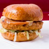 Salmon Burger  · Grilled Alaskan salmon, grilled tomatoes, grilled onions, lettuce & tartar sauce.