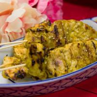 Chicken Satay (4) · Skewed chicken tender marinated in curry and coconut milk Served with peanut sauce.