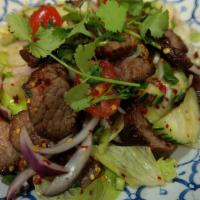 Yum Neau · Sliced barbeque beef with lettuce, cucumber, tomatoes, red onion, green onion, celery, cilan...