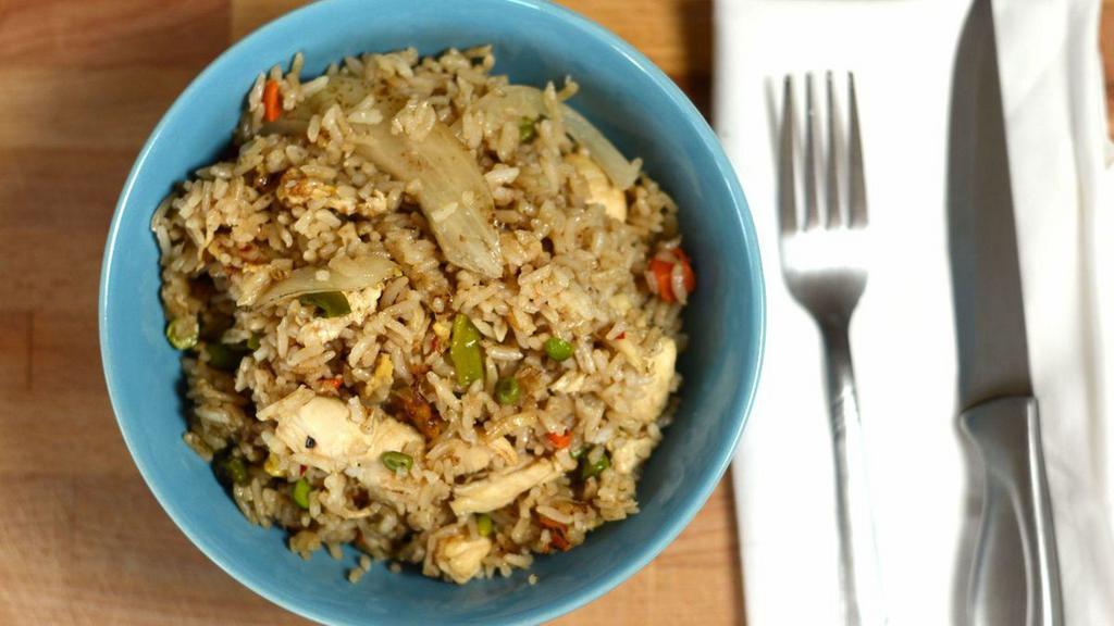 Kow Pad Fried Rice · Thai style fried-rice with onions, diced peas, carrots and egg.