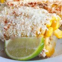 Street Corn · Three mini corn on the cob covered with mayo, crumbled cotija cheese, chili powder, and lime...
