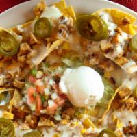 Tortilla Loaded · Fried corn tortilla chips, topped with refried beans, mix cheese, cheese sauce, shredded chi...