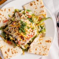 Crunchy Tortilla Salad · Lettuce, tortilla strips, corn salsa, tomatoes, mix cheese, and cilantro tossed with balsami...
